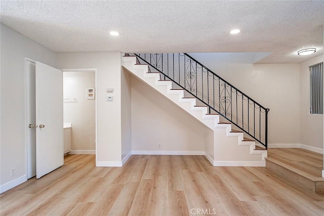 11408 Herb St Unit 7, South El Monte, CA 91733 - stairway featuring a textured ceiling, wood finished floors, recessed lighting, and baseboards