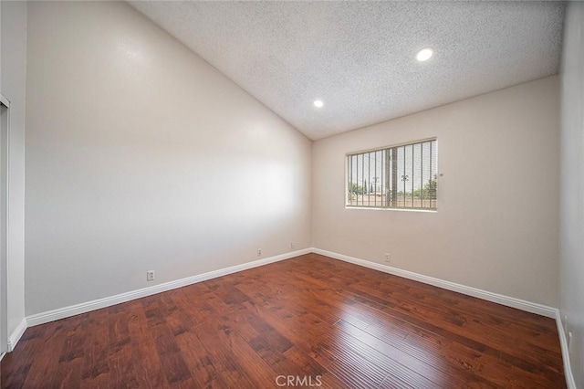 11408 Herb St Unit 7, South El Monte, CA 91733 - spare room featuring a textured ceiling, lofted ceiling, wood finished floors, baseboards, and recessed lighting