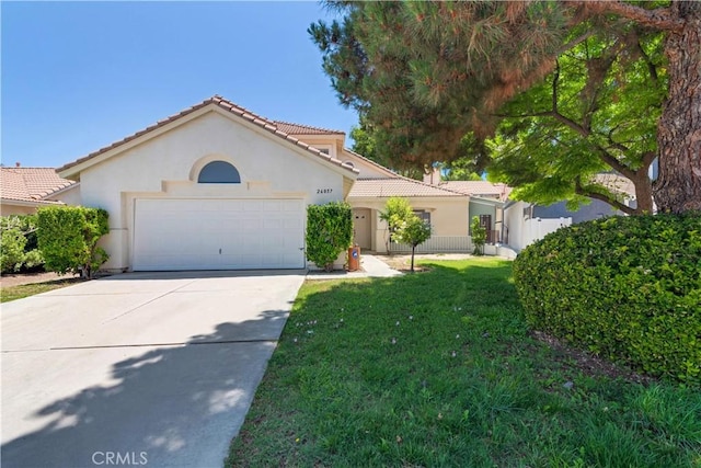 26057 Crestmont Cir, Menifee, CA 92586 - mediterranean / spanish house featuring an attached garage, stucco siding, a tile roof, and concrete driveway