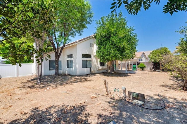26057 Crestmont Cir, Menifee, CA 92586 - back of house featuring stucco siding and a tiled roof