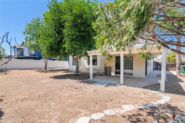 26057 Crestmont Cir, Menifee, CA 92586 - back of house featuring a patio, stucco siding, and a fenced backyard