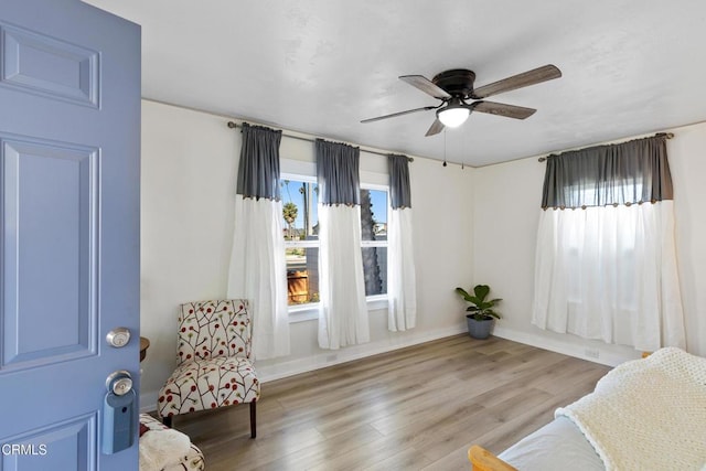 618 S C St, Oxnard, CA 93030 - living area featuring a ceiling fan, wood finished floors, and baseboards