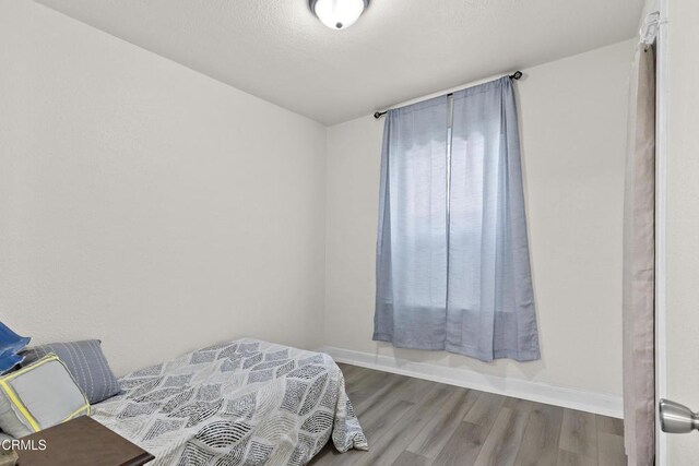 618 S C St, Oxnard, CA 93030 - bedroom featuring wood finished floors and baseboards