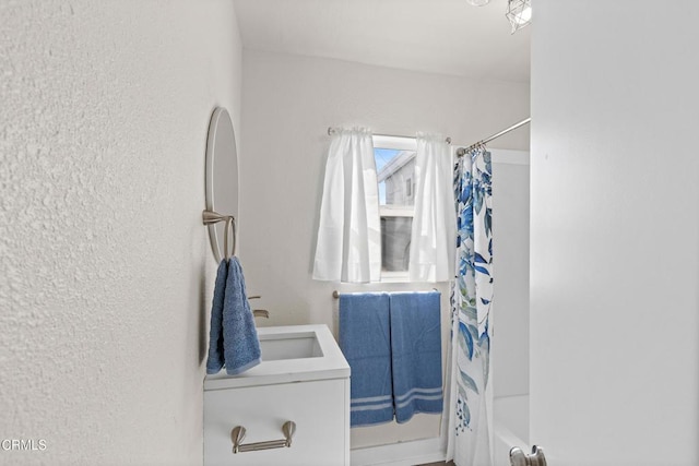 618 S C St, Oxnard, CA 93030 - full bathroom with vanity, a textured wall, and shower / bath combo