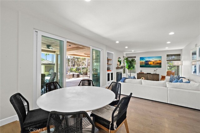 18976 Rockinghorse Ln, Huntington Beach, CA 92648 - dining space featuring recessed lighting, wood finished floors, built in features, and baseboards