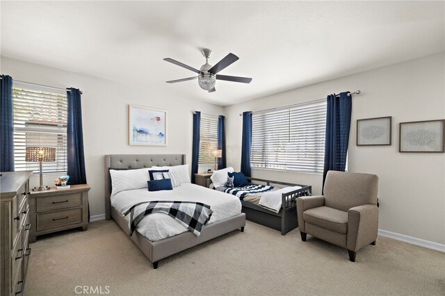 18976 Rockinghorse Ln, Huntington Beach, CA 92648 - bedroom featuring light carpet, baseboards, and a ceiling fan