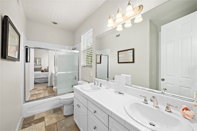 18976 Rockinghorse Ln, Huntington Beach, CA 92648 - full bath with an enclosed shower, toilet, double vanity, and stone tile floors