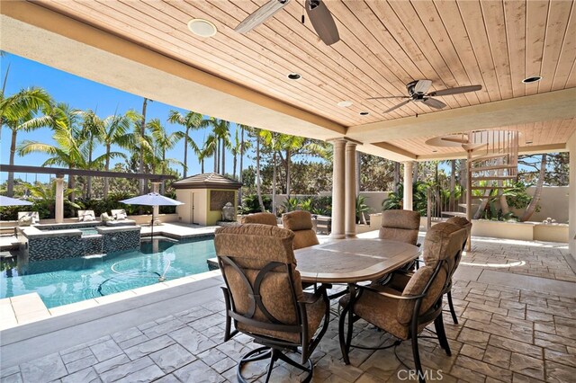 18976 Rockinghorse Ln, Huntington Beach, CA 92648 - view of patio / terrace with ceiling fan, a pool with connected hot tub, and outdoor dining area