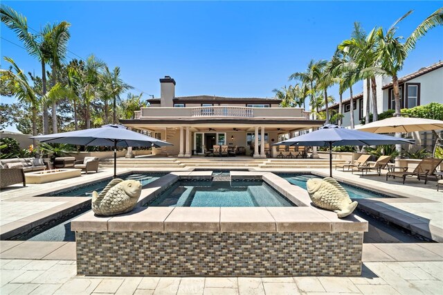 18976 Rockinghorse Ln, Huntington Beach, CA 92648 - swimming pool with an in-ground hot tub, a patio area, and an outdoor living space
