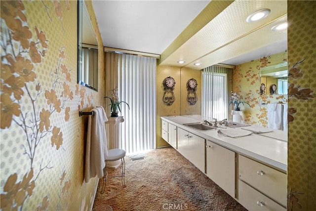 21166 E Rimpath Dr, Covina, CA 91724 - bathroom with wallpapered walls, vanity, and recessed lighting