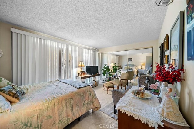 21166 E Rimpath Dr, Covina, CA 91724 - bedroom featuring carpet floors, a textured ceiling, and a closet