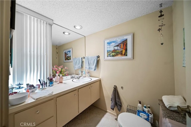21166 E Rimpath Dr, Covina, CA 91724 - bathroom with vanity, a textured ceiling, recessed lighting, and toilet