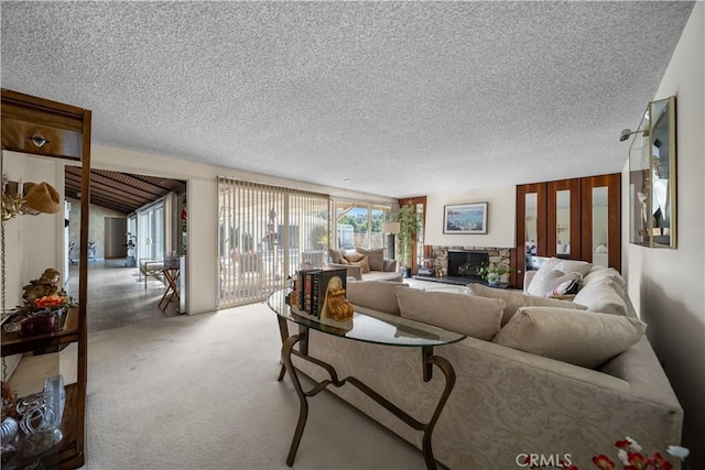 21166 E Rimpath Dr, Covina, CA 91724 - carpeted living room with a textured ceiling and a stone fireplace