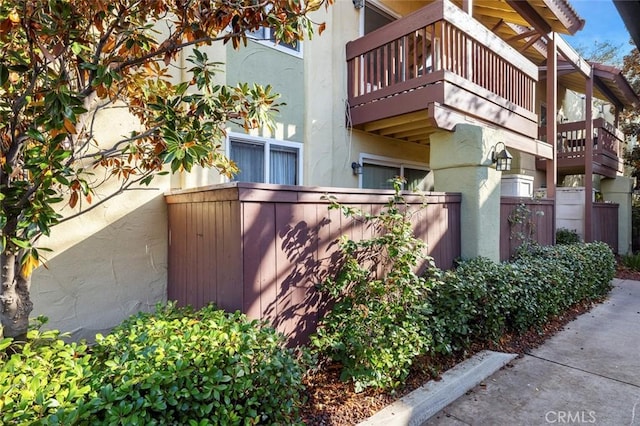 2881 Huntington Blvd Unit 137, Fresno, CA 93721 - view of side of home featuring a balcony and stucco siding