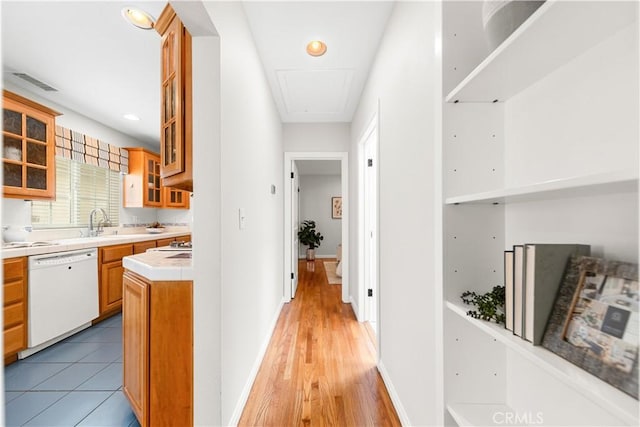 1518 Ocean Ave, Seal Beach, CA 90740 - corridor featuring attic access, a sink, and light wood-type flooring