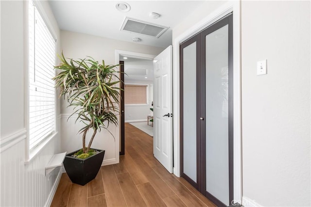1518 Ocean Ave, Seal Beach, CA 90740 - corridor featuring wood finished floors and plenty of natural light