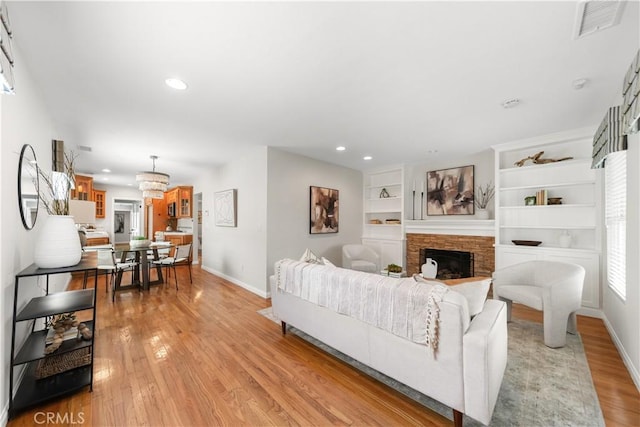 1518 Ocean Ave, Seal Beach, CA 90740 - living room with baseboards, light wood finished floors, a stone fireplace, recessed lighting, and built in features