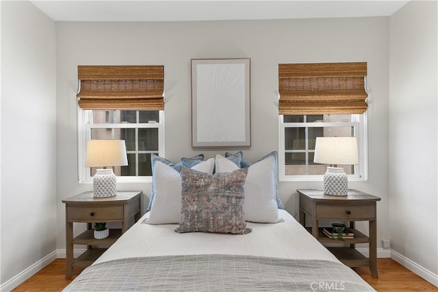 1518 Ocean Ave, Seal Beach, CA 90740 - bedroom featuring wood finished floors, baseboards, and multiple windows