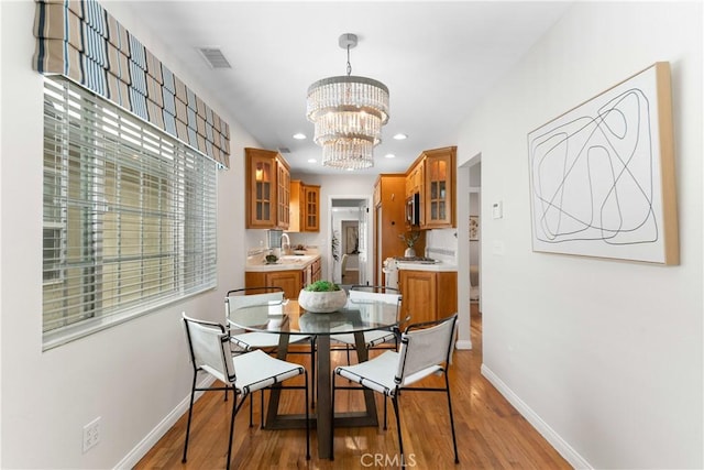 1518 Ocean Ave, Seal Beach, CA 90740 - dining room with baseboards, a chandelier, light wood-type flooring, and recessed lighting