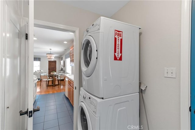 1518 Ocean Ave, Seal Beach, CA 90740 - laundry room featuring stacked washing machine and dryer, tile patterned flooring, and recessed lighting