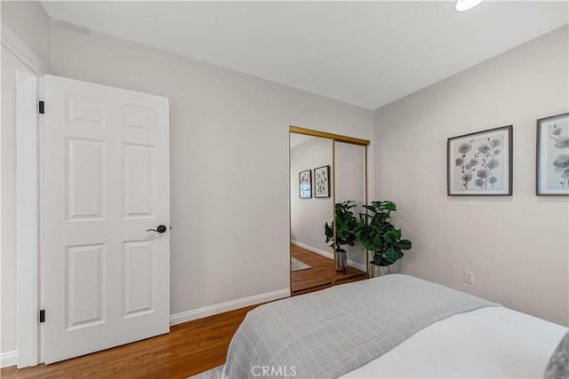 1518 Ocean Ave, Seal Beach, CA 90740 - bedroom featuring wood finished floors, baseboards, and a closet