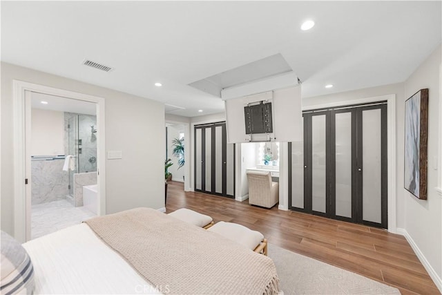 1518 Ocean Ave, Seal Beach, CA 90740 - bedroom featuring wood finished floors, recessed lighting, connected bathroom, and baseboards