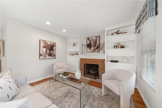 1518 Ocean Ave, Seal Beach, CA 90740 - living room with baseboards, wood finished floors, a stone fireplace, recessed lighting, and built in features