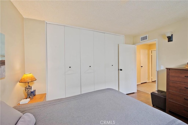 4252 Fair Ave Unit 2, North Hollywood, CA 91602 - bedroom with a closet, wood finished floors, and a textured ceiling
