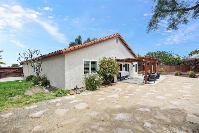 2818 Via Blanco, San Clemente, CA 92673 - back of property featuring a pergola, a patio, a fenced backyard, stucco siding, and a tiled roof