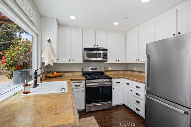 2818 Via Blanco, San Clemente, CA 92673 - kitchen with stainless steel appliances, a sink, light countertops, white cabinets, and recessed lighting