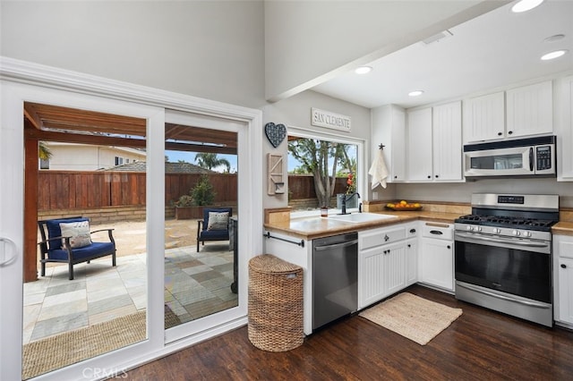 2818 Via Blanco, San Clemente, CA 92673 - kitchen with stainless steel appliances, dark wood-style flooring, recessed lighting, white cabinetry, and a sink