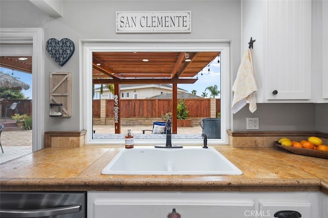 2818 Via Blanco, San Clemente, CA 92673 - kitchen featuring a sink, stainless steel dishwasher, white cabinetry, and light countertops