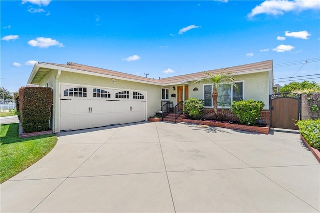 11628 Cedarvale St, Norwalk, CA 90650 - ranch-style house with driveway, stucco siding, a garage, a gate, and brick siding