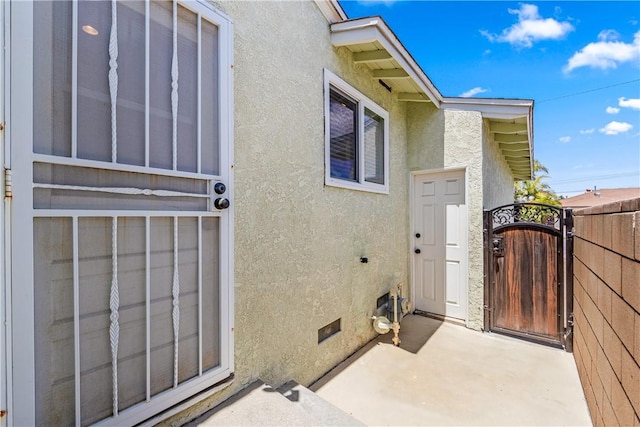 11628 Cedarvale St, Norwalk, CA 90650 - entrance to property featuring stucco siding, a gate, and a patio area