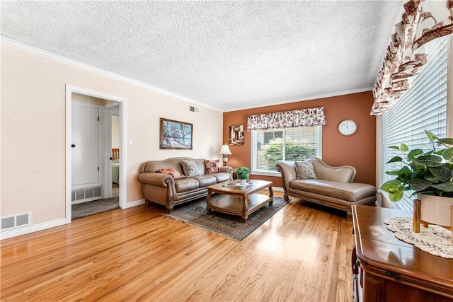 11628 Cedarvale St, Norwalk, CA 90650 - living room with a textured ceiling, light wood finished floors, ornamental molding, and baseboards