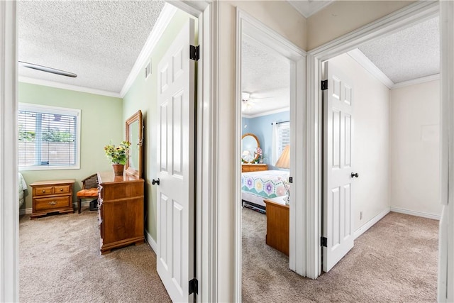 11628 Cedarvale St, Norwalk, CA 90650 - hallway featuring a textured ceiling, carpet floors, crown molding, and baseboards