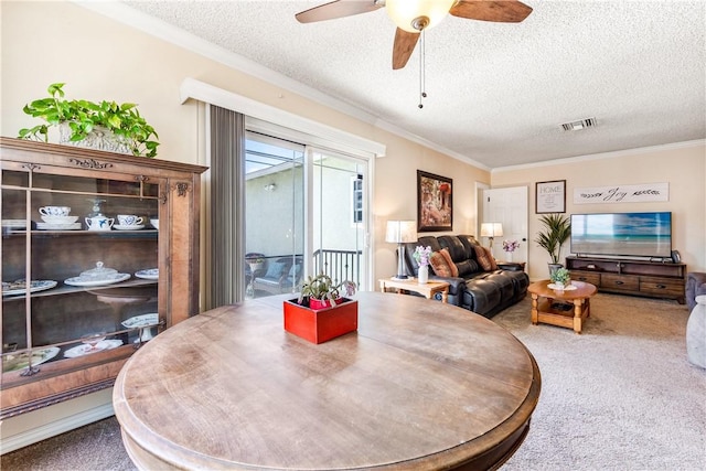 11628 Cedarvale St, Norwalk, CA 90650 - dining room featuring carpet floors, a textured ceiling, crown molding, and a ceiling fan