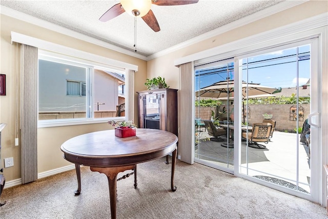 11628 Cedarvale St, Norwalk, CA 90650 - carpeted dining area featuring a textured ceiling, a ceiling fan, crown molding, and baseboards