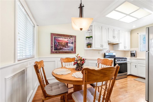 11628 Cedarvale St, Norwalk, CA 90650 - dining room featuring light wood-style flooring and wainscoting