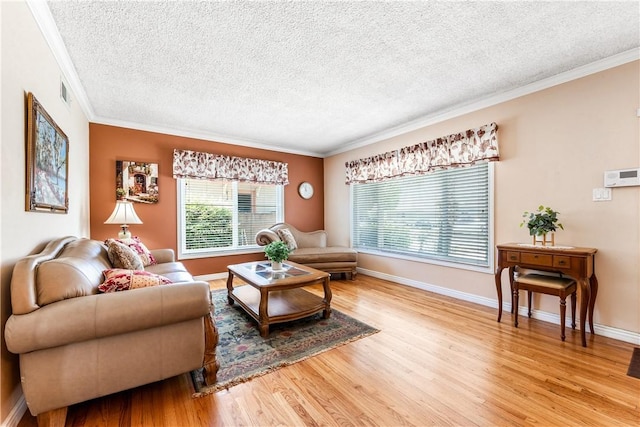11628 Cedarvale St, Norwalk, CA 90650 - living room with a textured ceiling, light wood finished floors, crown molding, and baseboards