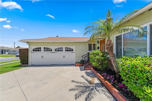11628 Cedarvale St, Norwalk, CA 90650 - single story home featuring stucco siding, concrete driveway, and a garage