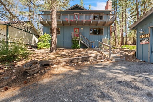 42646 Constellation Dr, Big Bear Lake, CA 92315 - back of property featuring a balcony and a chimney