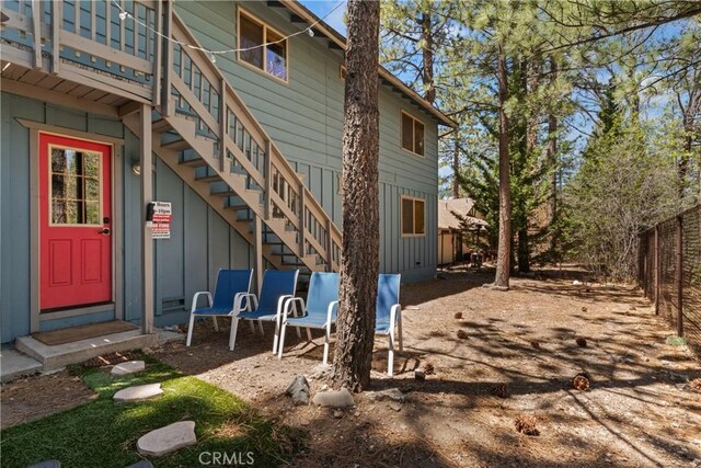 42646 Constellation Dr, Big Bear Lake, CA 92315 - back of house with stairway, board and batten siding, and entry steps