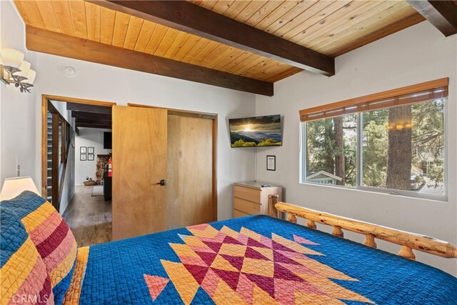 42646 Constellation Dr, Big Bear Lake, CA 92315 - bedroom featuring wooden ceiling with exposed beams, wood finished floors, and a closet