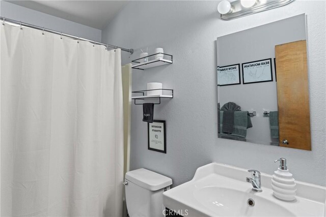 42646 Constellation Dr, Big Bear Lake, CA 92315 - bathroom with toilet, a sink, and curtained shower