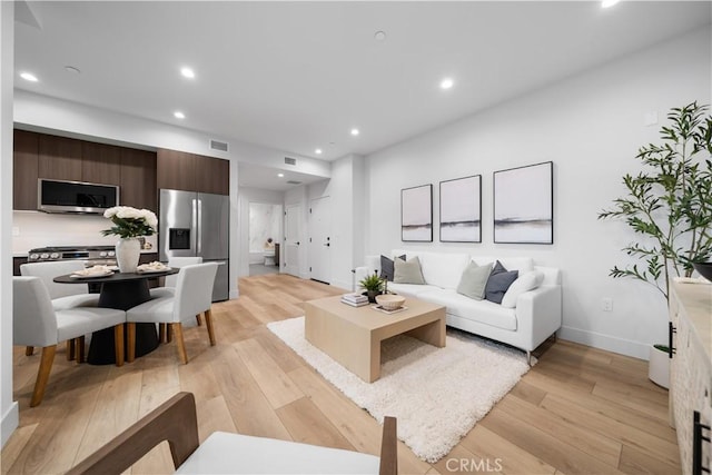 150 S Oak Knoll Ave Unit 103, Pasadena, CA 91101 - living area featuring light wood-style floors, recessed lighting, and baseboards