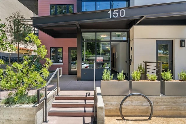 150 S Oak Knoll Ave Unit 103, Pasadena, CA 91101 - doorway to property featuring stucco siding