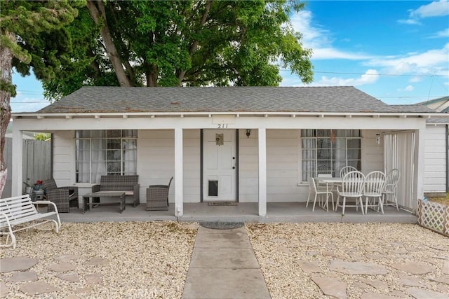 211 S K St, Lompoc, CA 93436 - view of front of property with an outdoor hangout area, roof with shingles, and a porch