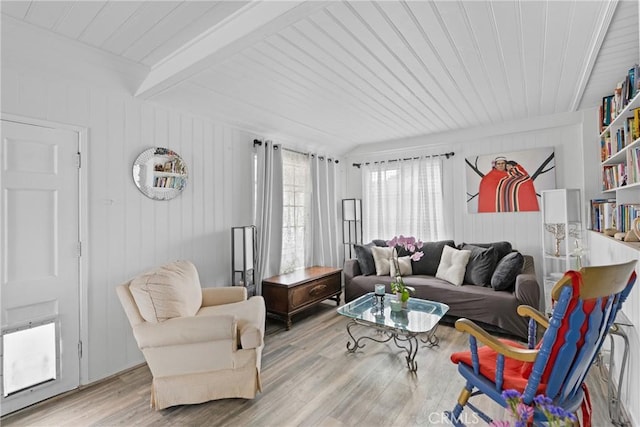 211 S K St, Lompoc, CA 93436 - living area featuring light wood-type flooring, wood ceiling with exposed beams, and wood walls