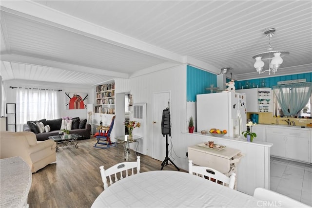 211 S K St, Lompoc, CA 93436 - dining area featuring beamed ceiling and a chandelier